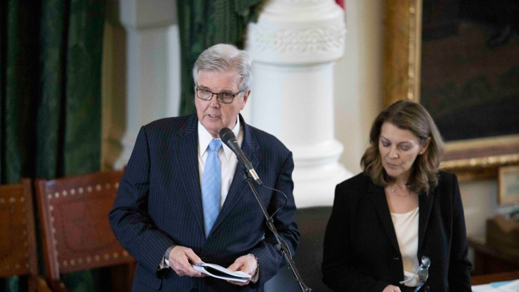 Lt. Gov. Dan Patrick reads from a rule book on Saturday, May 29, 2021. At right is Senate...