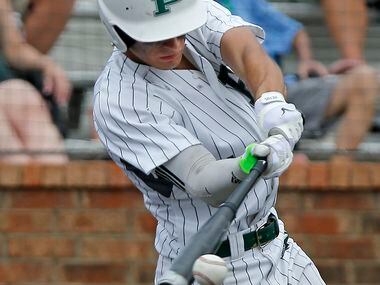 Prosper shortstop Chase Pendley (1) makes contact in the fifth inning as Prosper High School...