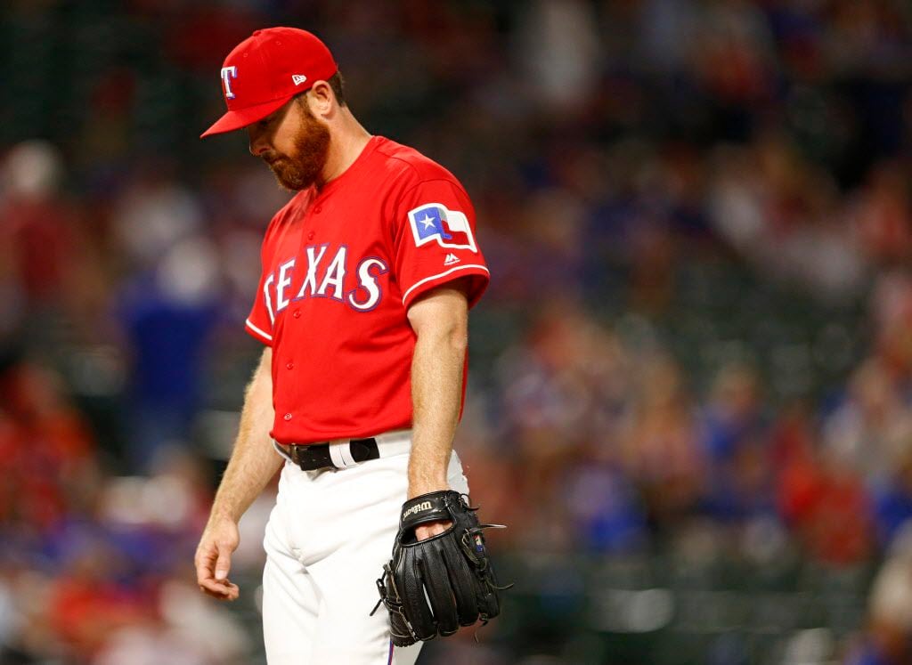 Texas Rangers relief pitcher Sam Dyson (47) exits the field after Texas Rangers manager Jeff...