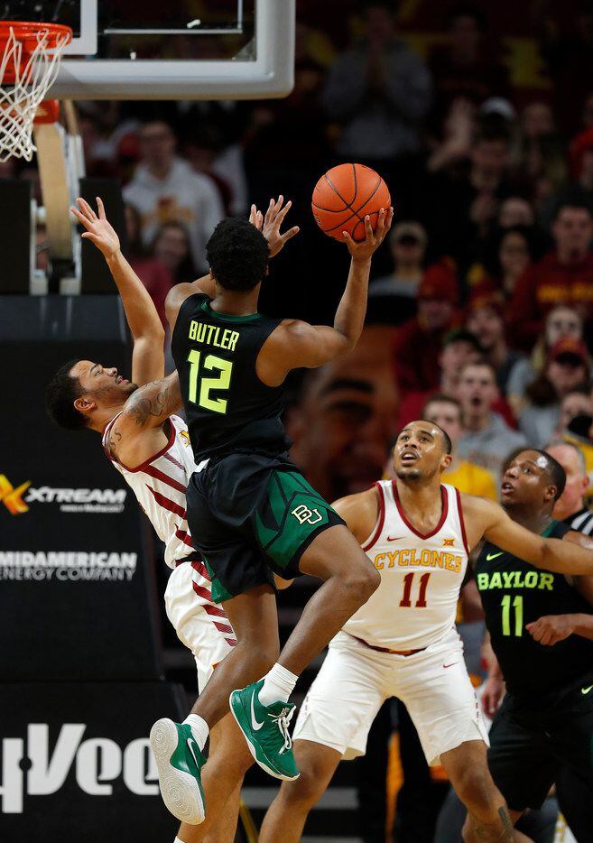 Baylor guard Jared Butler, center, drives to the basket for the shot as Iowa State guard Nick Weiler-Babb, left, defends during the first half of an NCAA college basketball game, Tuesday, Feb. 19, 2019, in Ames, Iowa. (AP Photo/Matthew Putney)