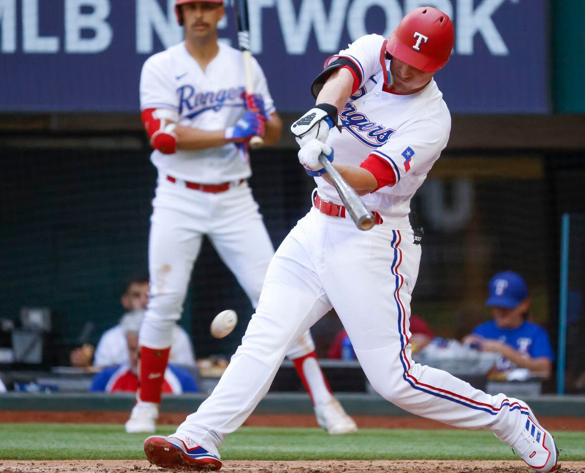 Texas Rangers shortstop Corey Seager (5) hits as he gets grounds out during the second...