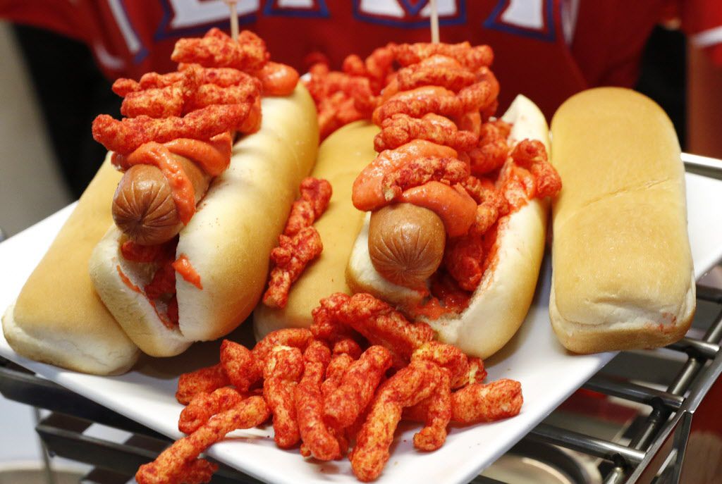 The Flamin' Hot Cheetos Dog is an all beef hot dog topped with Flamin' Hot Cheetos infused...