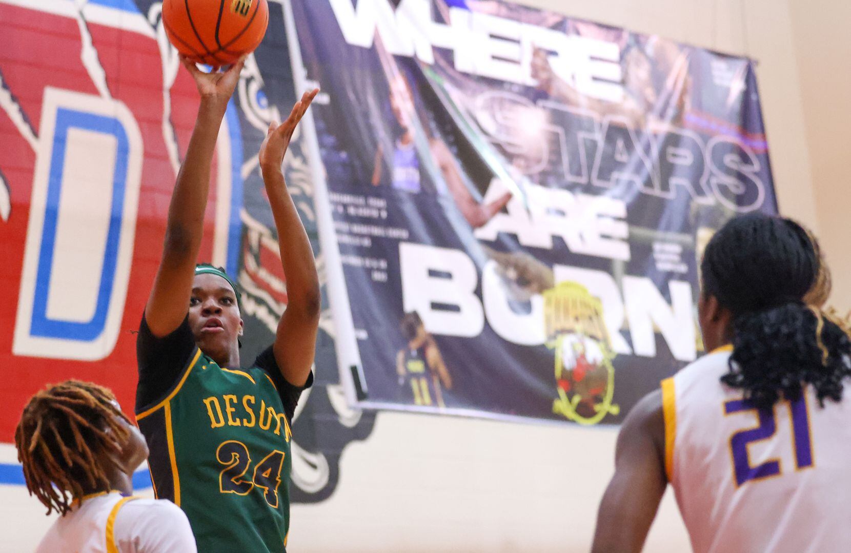 DeSoto small forward Amari Byles (24) makes a shot at the net during a game against...