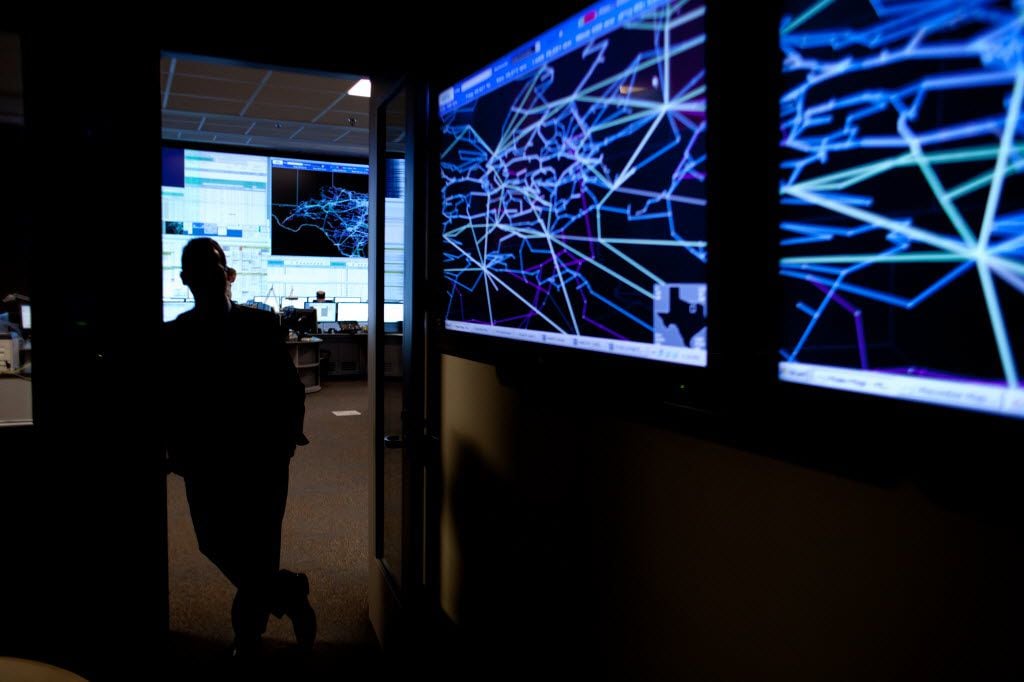 Screens display the power grid of the Dallas-Fort Worth area in the conference room of the...