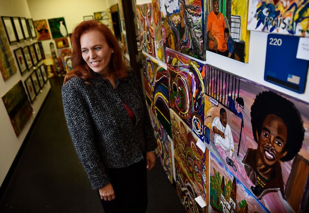 Brenda Snitzer walks the halls at The Stewpot offices that features work from the agency's...