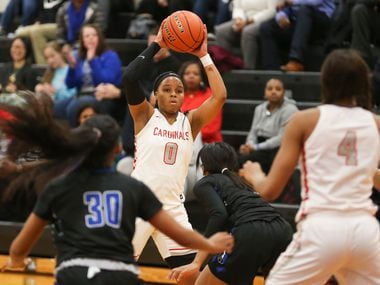 MacArthur junior guard Sarah Andrews (0) looks to make a pass to senior forward Tailor Broussard (4) during a matchup between the MacArthur Cardinals and the Hebron Hawks on Tuesday, Jan. 29, 2019 in Irving, Texas. (Ryan Michalesko/The Dallas Morning News)