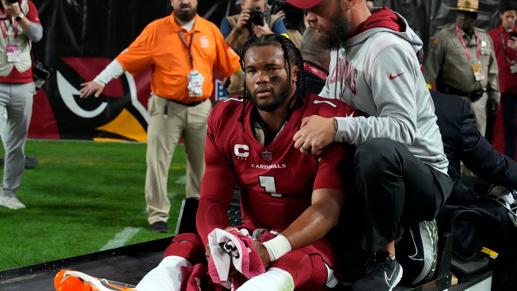 Arizona Cardinals quarterback Kyler Murray (1) leaves the game with an injury during the...