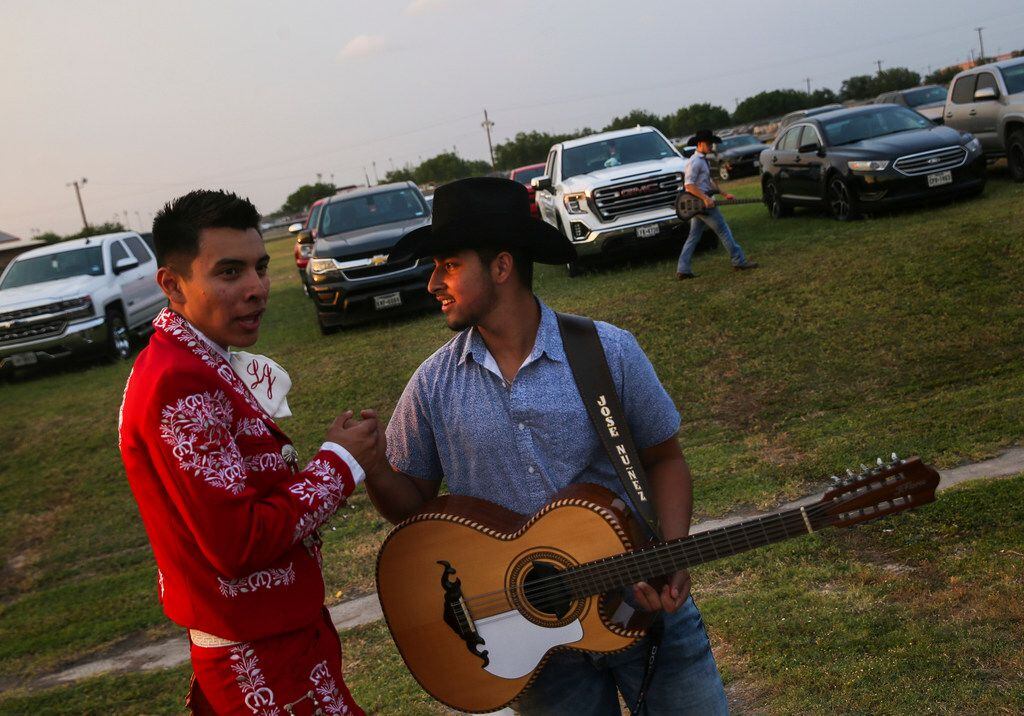 Brandon Lozano (left) and Jose Pepe Nunez greet each other before performing during La Joya...