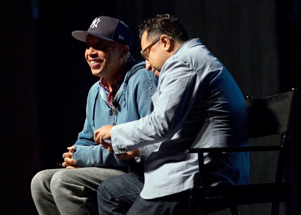  Russell Simmons talks Friday evening with Clyde Valentin during the Dallas Festival of...