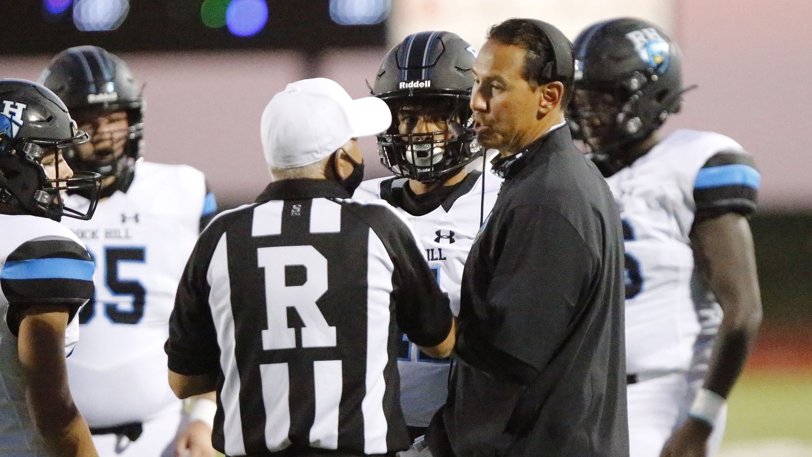 Prosper Rock Hill football coach Mark Humble talks to an official during a game against...