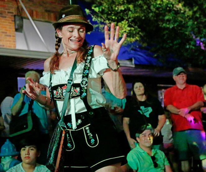 Elizabeth Fitzpatrick dances during Oktoberfest in downtown McKinney.