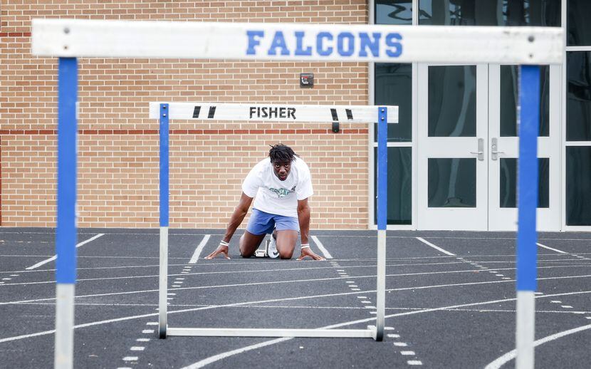 North Forney High School senior Alexander Chukwukelu looks at the hurdles in front of his as...