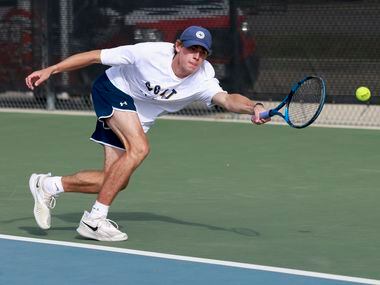 Highland Park’s Ray Saalfield stretches for a shot during the 5A boys doubles championship...