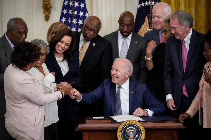 President Joe Biden signs the Juneteenth National Independence Day Act in the East Room of...