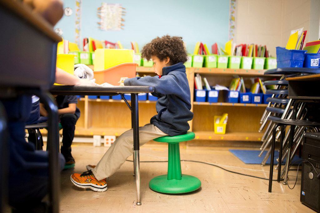 Jaxon Youngblood, 7, sits on a wobble stool donated through DonorsChoose.org at Hexter...