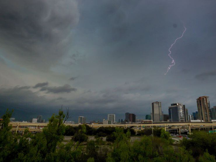 Lighting lights up the sky as storm clouds gather over downtown Dallas on March 16.