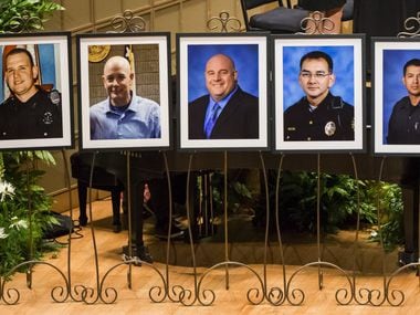 Photos of five officers who died were displayed during during an interfaith memorial service...