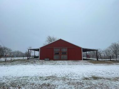 Snow coats a barn in Howe, Texas on Jan. 31, 2023.