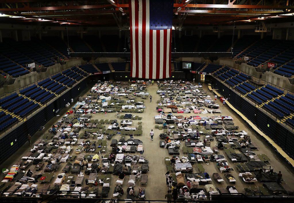 BATON ROUGE, LA - AUGUST 19:  Evacuees take advantage of the shelter setup in the The Baton...
