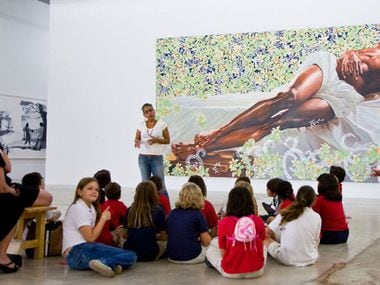 Works by Kehinde Wiley are on display as part of the "30 Americans" exhibit at the Arlington Museum of Art.