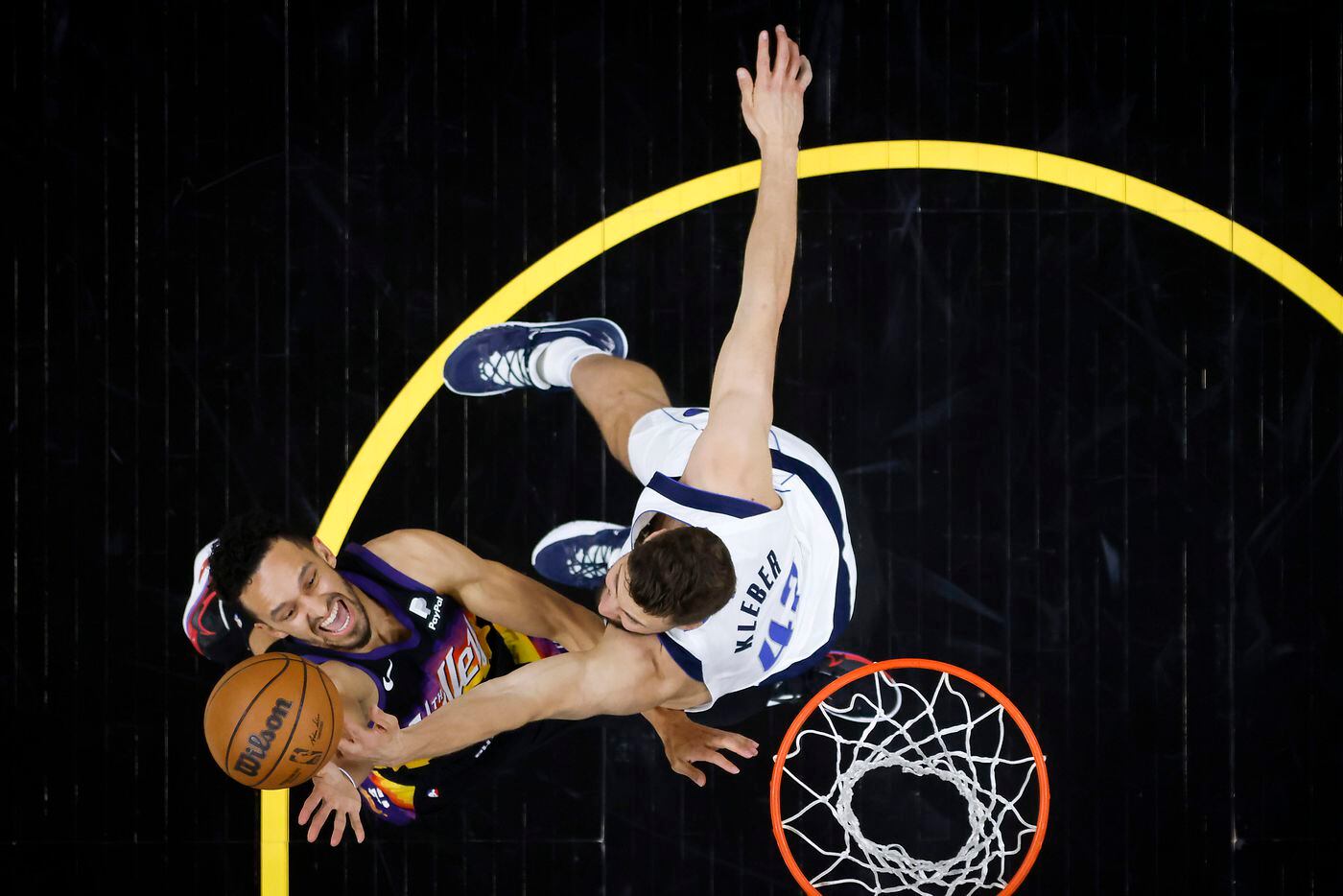 Dallas Mavericks forward Maxi Kleber (42) blocks a shot by Phoenix Suns guard Landry Shamet...