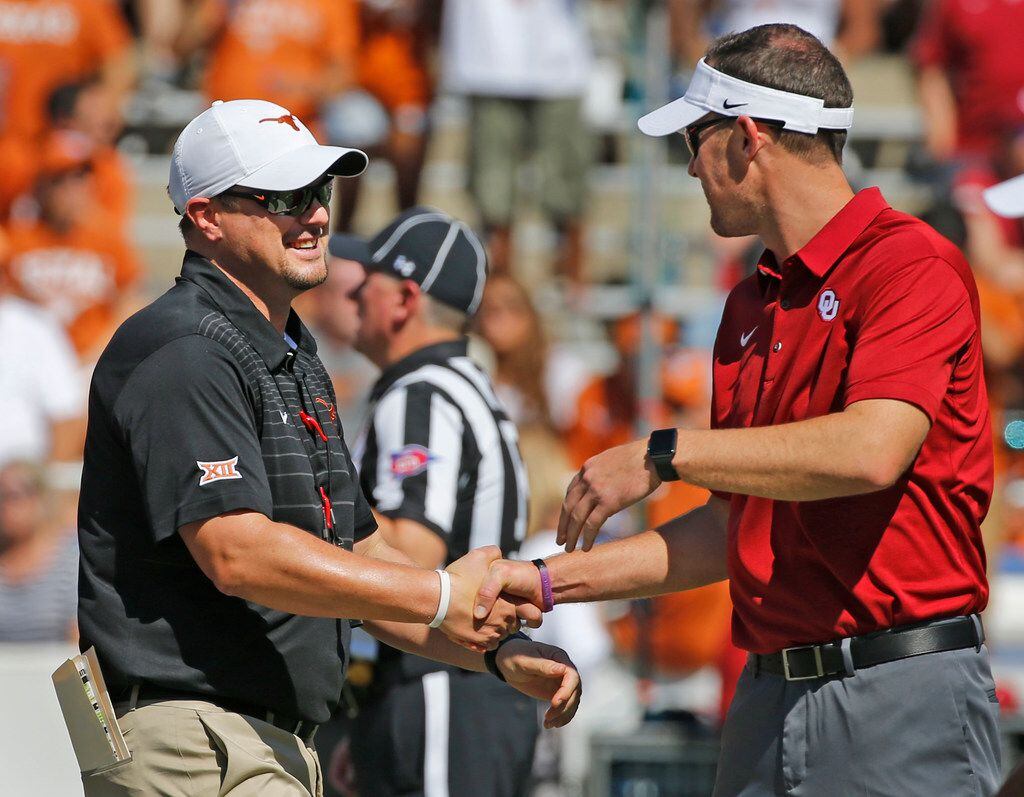 Texas head coach Tom Herman and Oklahoma head coach Lincoln Riley shake hands before the...