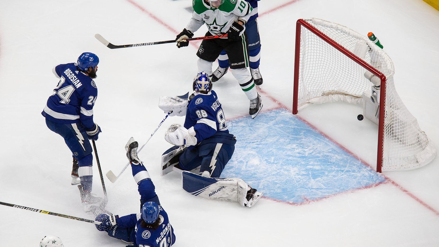 Corey Perry (10) of the Dallas Stars looks on as the puck sails past goaltender Andrei...