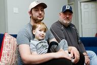 Stephen Dorfman, holding his son, Archer Vaughn. age 3. Both were caught in the middle of a...