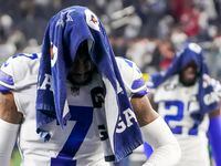 Dallas Cowboys cornerback Trevon Diggs (7) and safety Jayron Kearse (27) leave the field following a loss to the San Francisco 49ers in an NFL Wild Card playoff football game at AT&T Stadium on Sunday, Jan. 16, 2022, in Arlington.