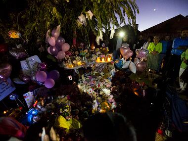 People gather at a memorial for missing three-year-old Sherin Mathews on Sunday, October 22,...