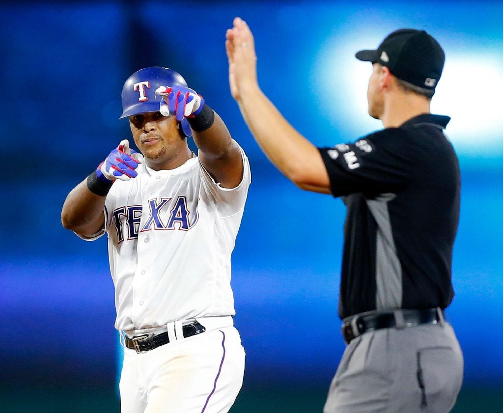 FILE - Adrian Beltre points to the bench after doubling off of Houston starting pitcher...