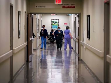 Staff at Faith Community Hospital move between rooms at the hospital on Thursday, May 14, 2020, in Jacksboro, Texas. (Smiley N. Pool/The Dallas Morning News)
