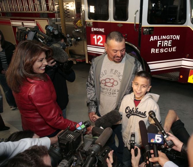 Koregan Quintanilla, with his father, Daniel Quintanilla, talked to reporters after meeting...