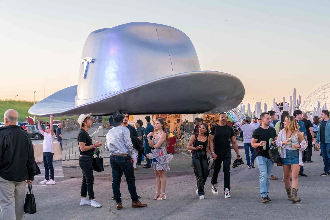 A giant cowboy hat is on display outside the Tesla Giga Texas manufacturing facility during...