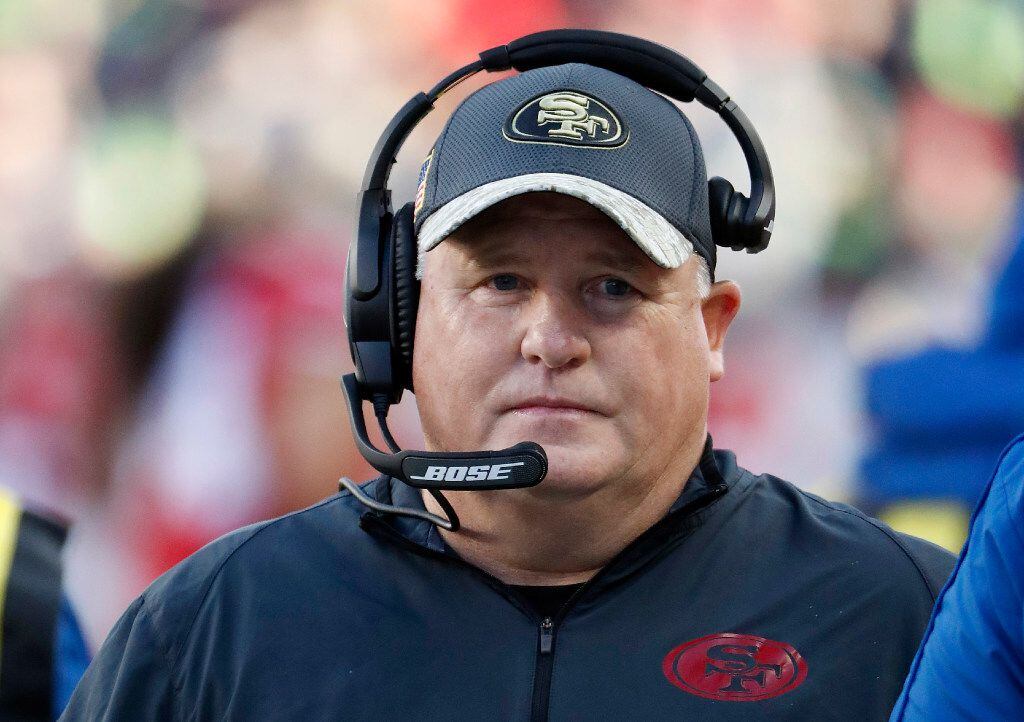 FILE - In this Jan. 1, 2017, file photo, San Francisco 49ers head coach Chip Kelly stands on...