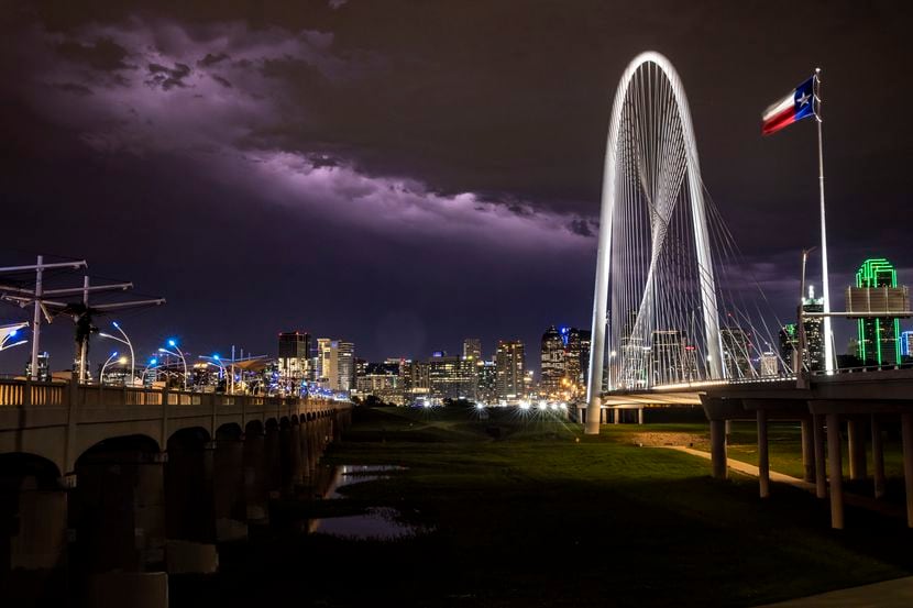 A lightning storm strikes in the backdrop of the skyline in downtown Dallas on Monday night,...