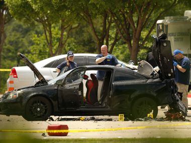 FBI personnel document the crime scene on May 4, 2015, outside Curtis Culwell Center in...