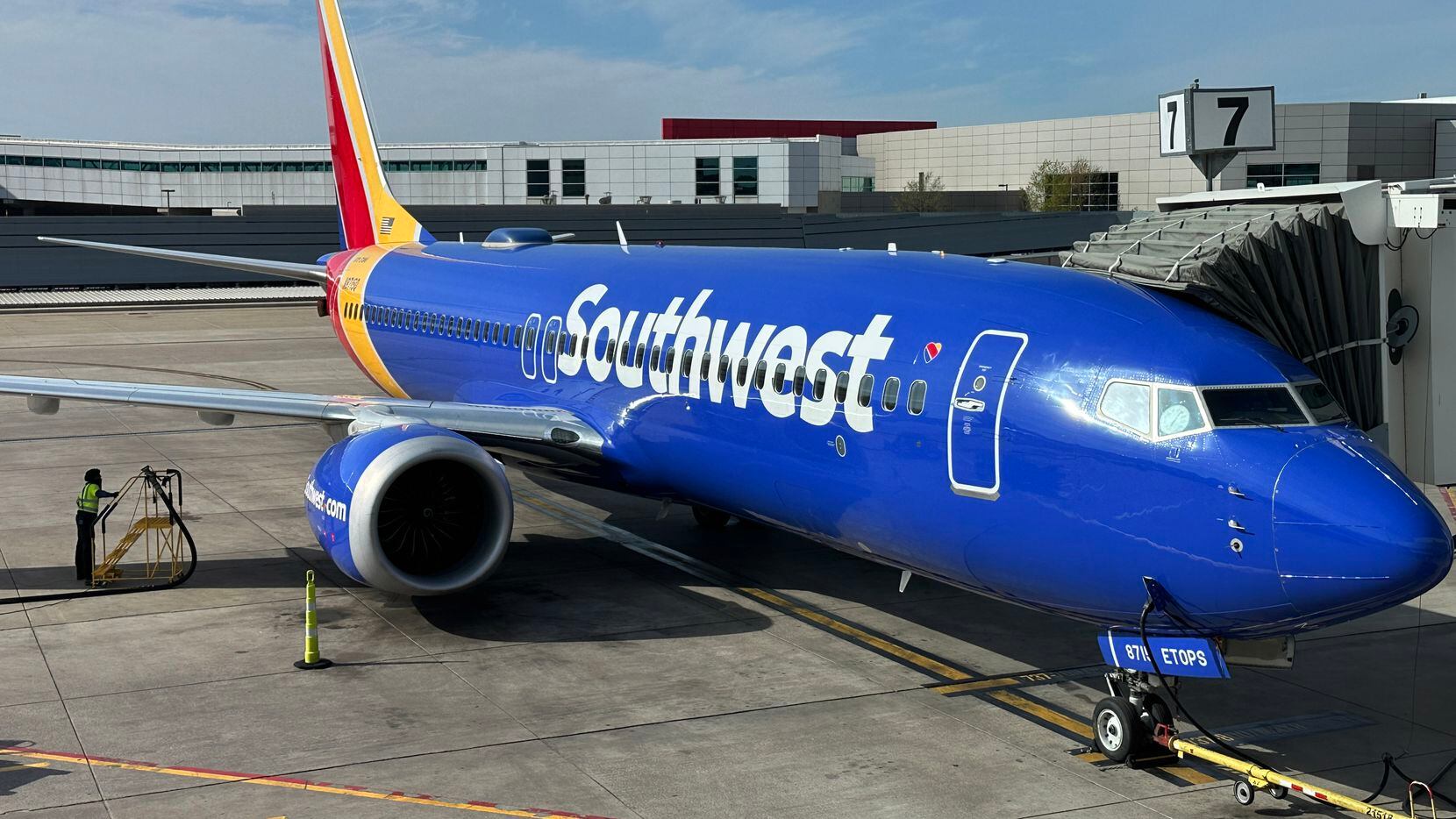 A Southwest Airlines plane sits at the gate at Love Field, in Dallas, TX. on March 19, 2023.