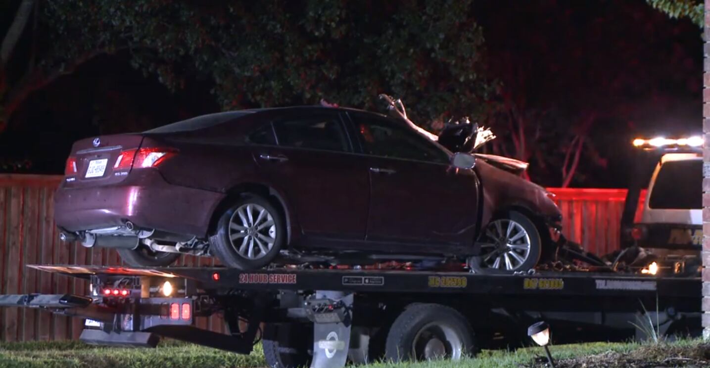A tow truck removed a damaged car from the scene of a fatal crash Sunday night after one...