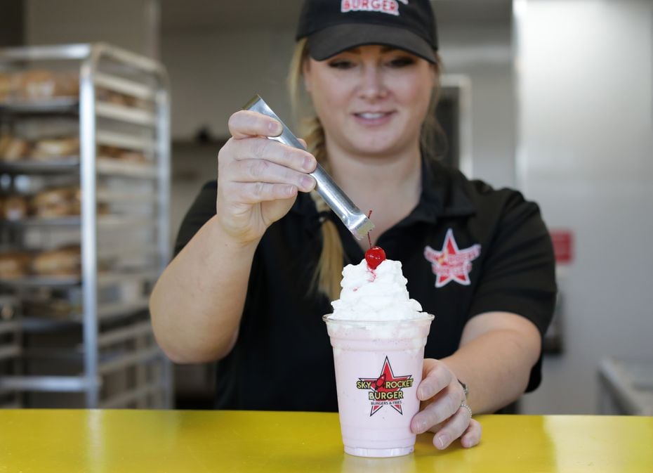 Meredith Palmer makes a strawberry milkshake at Sky Rocket Burger in Frisco. It's the newest...