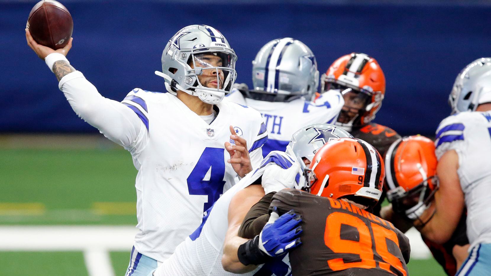 Dallas Cowboys quarterback Dak Prescott (4) throws a fourth quarter interception to...