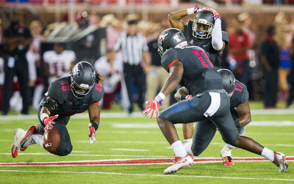 Southern Methodist Mustangs linebacker Anthony Rhone (48) dives to try to recover a narrowly...