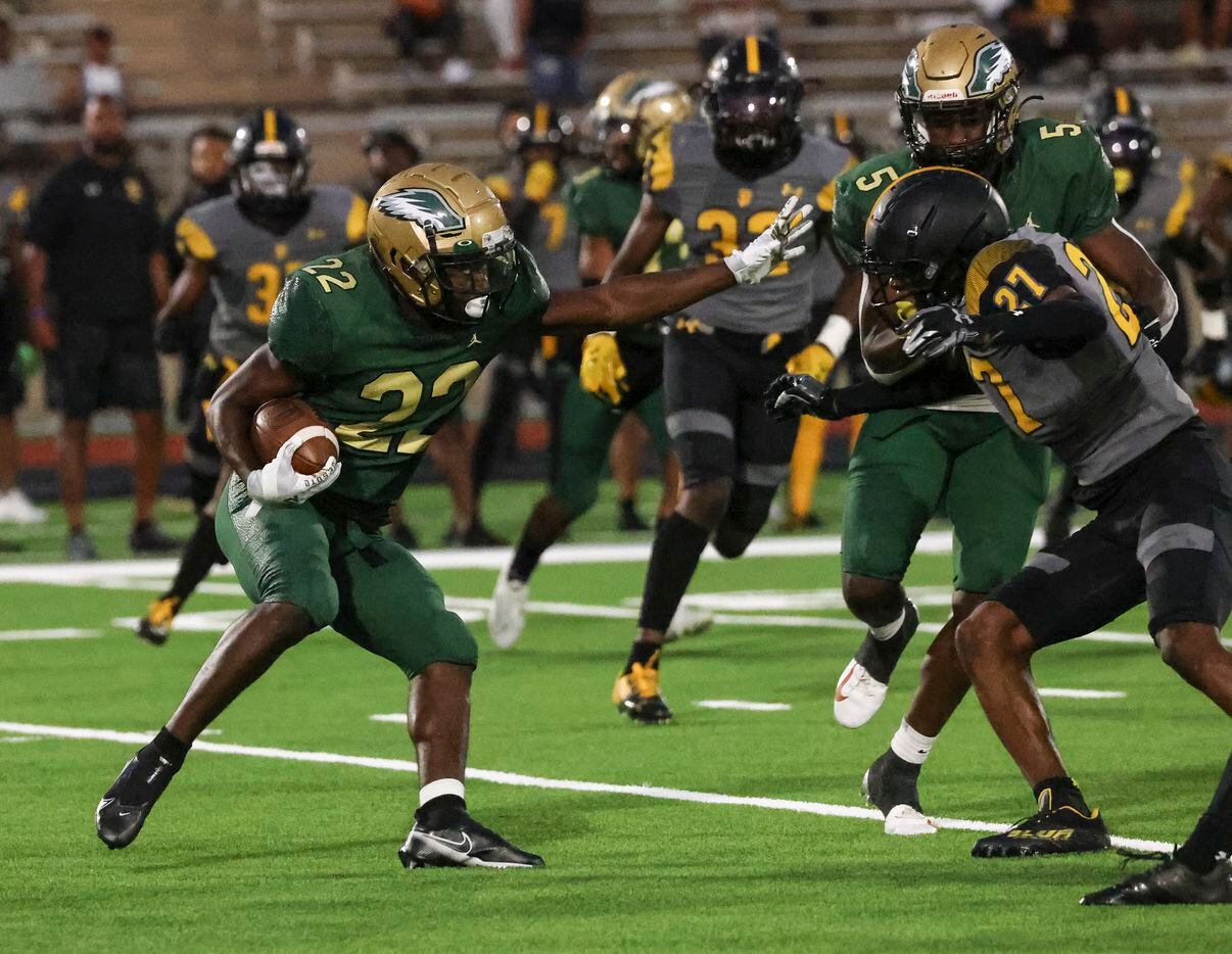 DeSoto High School Deondrae Riden Jr. (22) runs the ball up the field during the game...