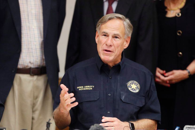 Texas Gov. Greg Abbott talks a mass shooting in Odessa during a news conference Sunday,...