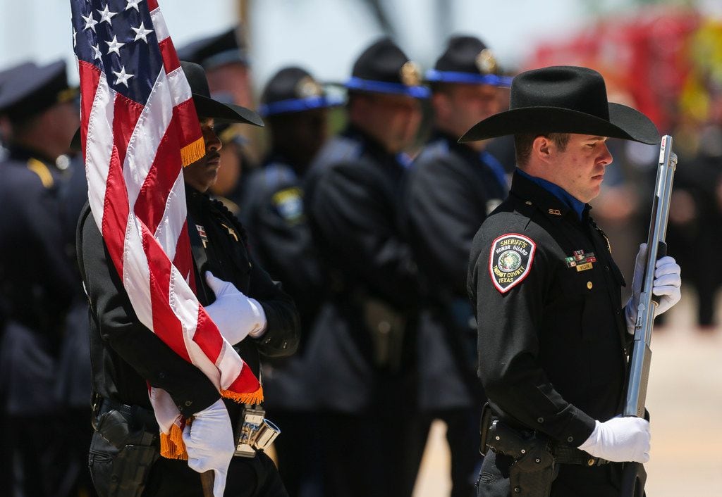 The Tarrant County Sheriff's Department's honor guard presented the colors Thursday during...