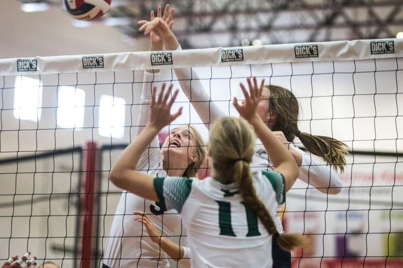 Prosper High School middle blocker and right side hitter  Shaylee Shore (11) attempts to...