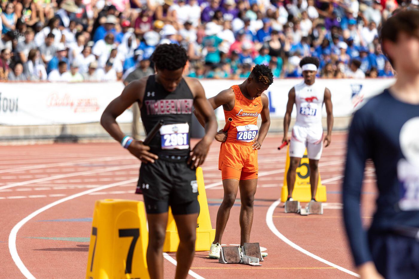 Nicholas Bird of Lancaster prepares to lead off the boys’ 4x100 relay at the UIL Track &...