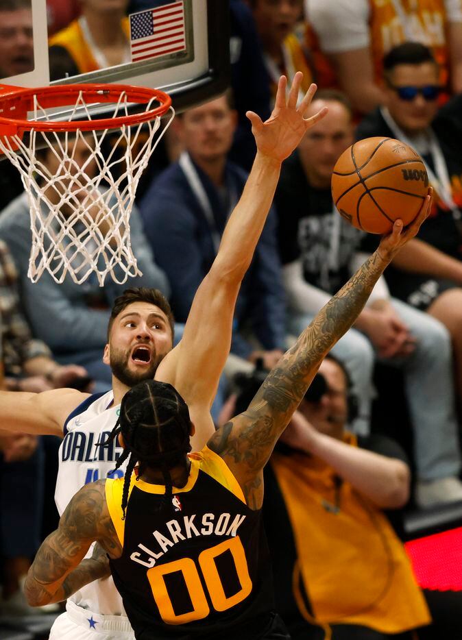 Dallas Mavericks forward Maxi Kleber (42) defends a shot by Utah Jazz guard Jordan Clarkson...