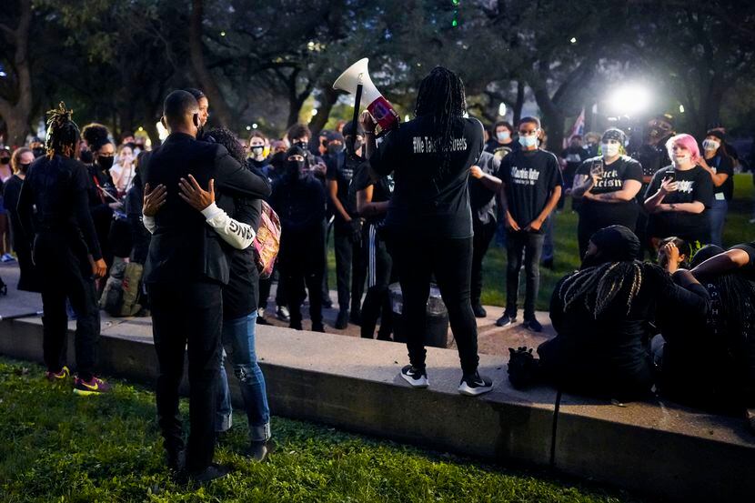 Demonstrators gather during a rally at Dallas City Hall after a Kentucky grand jury brought...