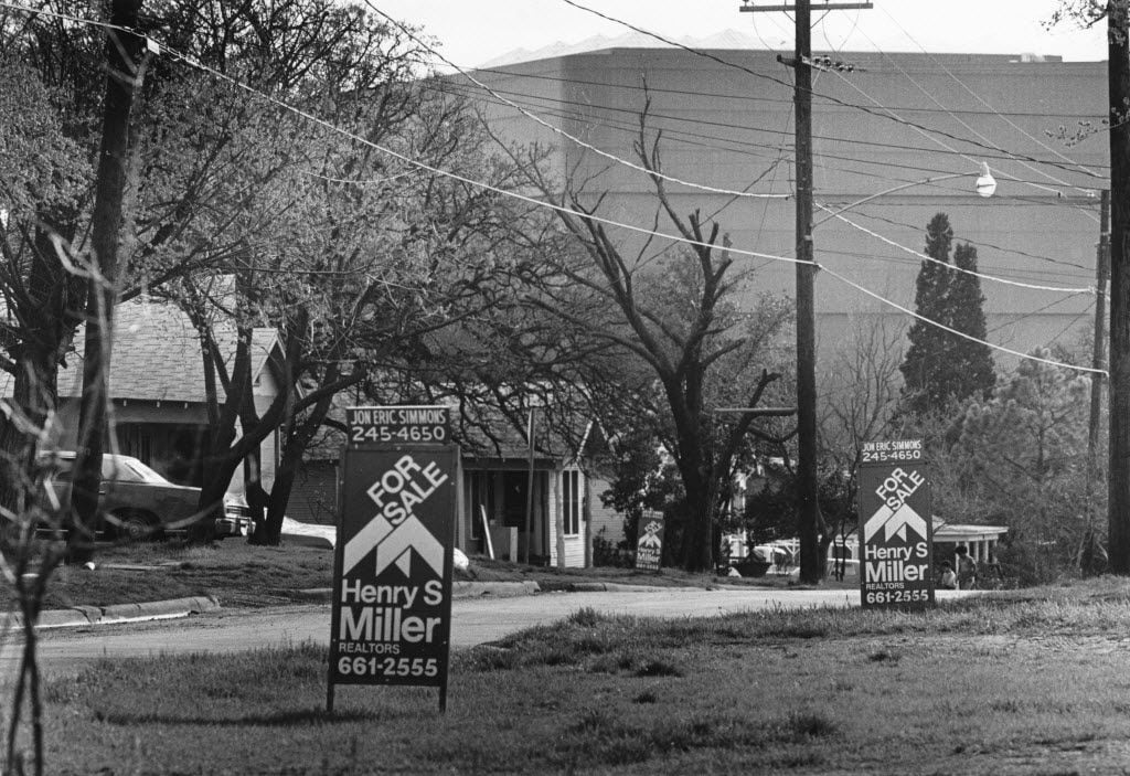 For sale signs in the Little Mexico neighborhood in 1981.  The World Trade Center can be seen in the background.